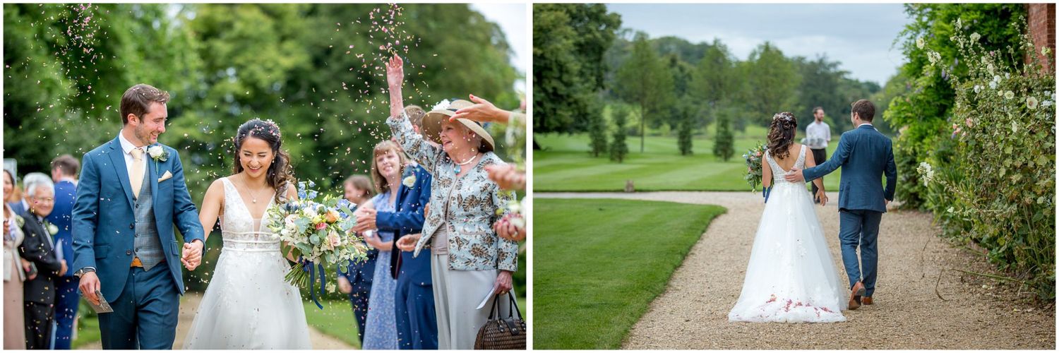 Garden wedding ceremony with guests lining the pathway.
