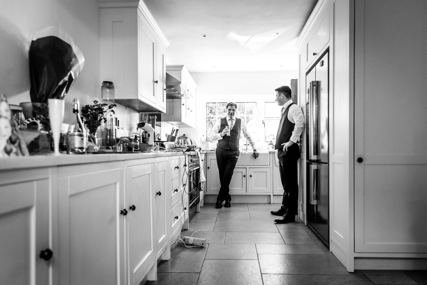 Black and white hallway interior shots showing wedding day preparations.