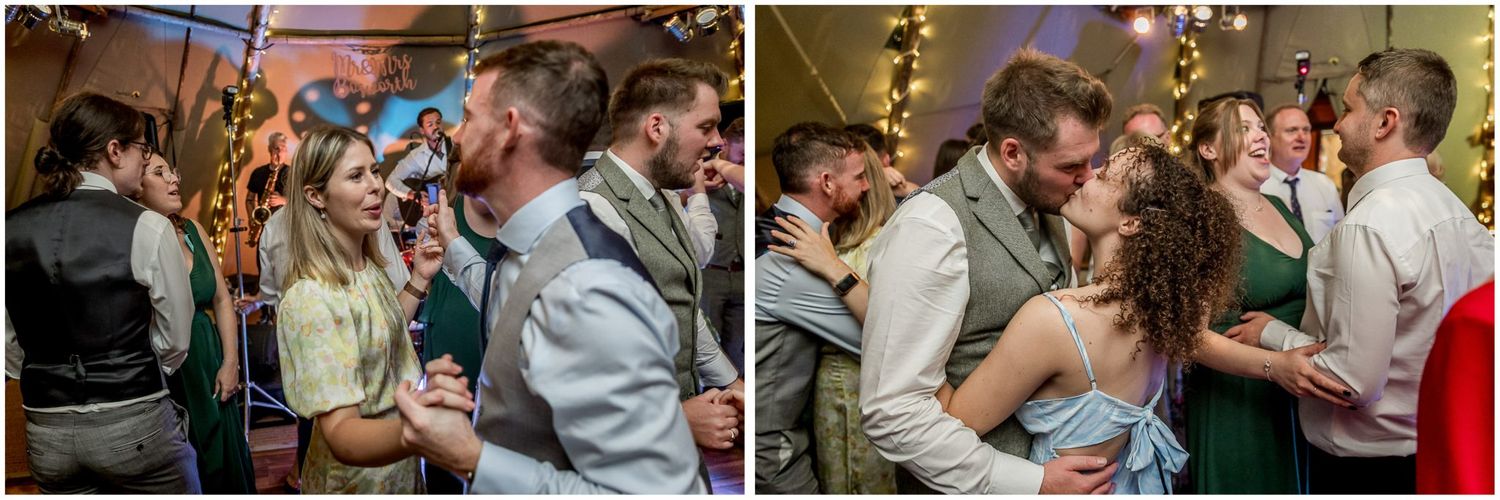 Couples dancing and celebrating at a lively wedding reception with colorful lighting.