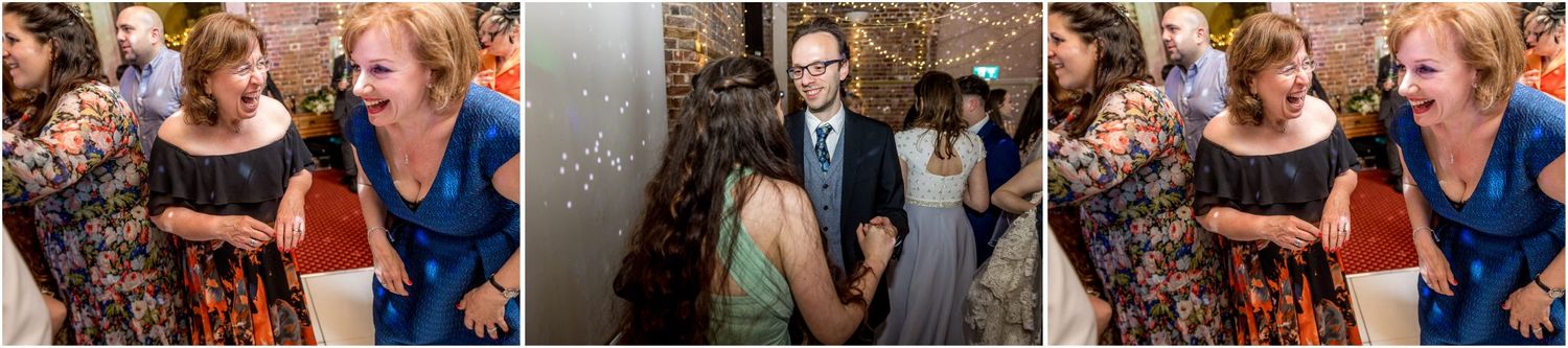 Wedding guests enjoying themselves during a vibrant reception celebration.