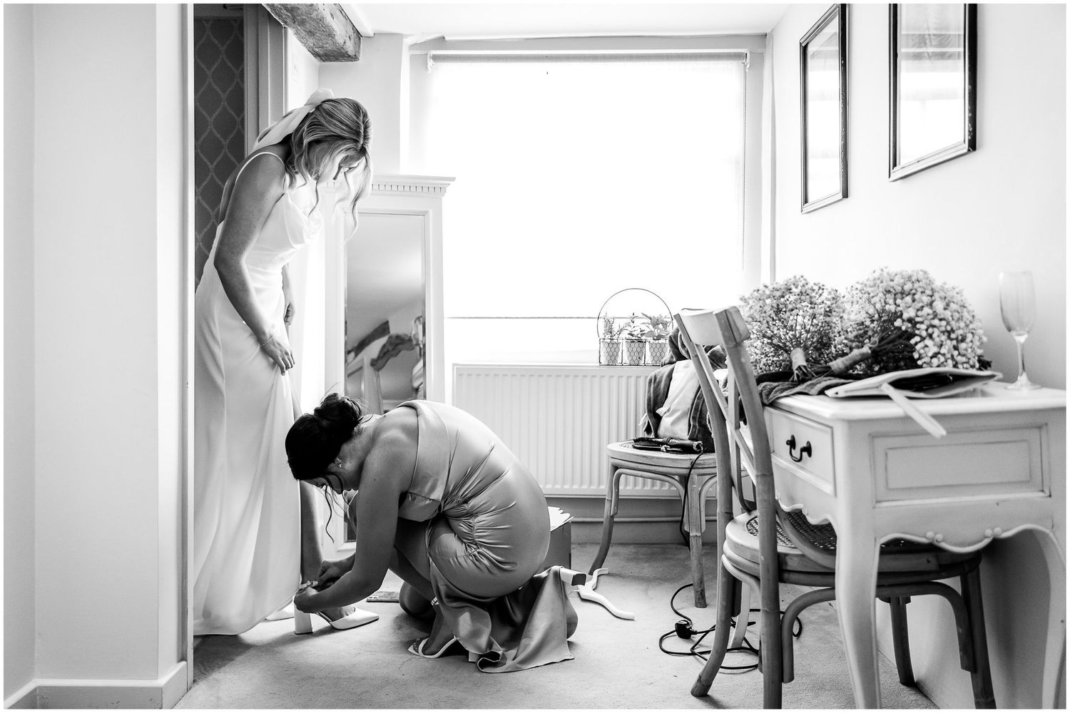 Natural light photography capturing quiet moments of wedding day preparations.