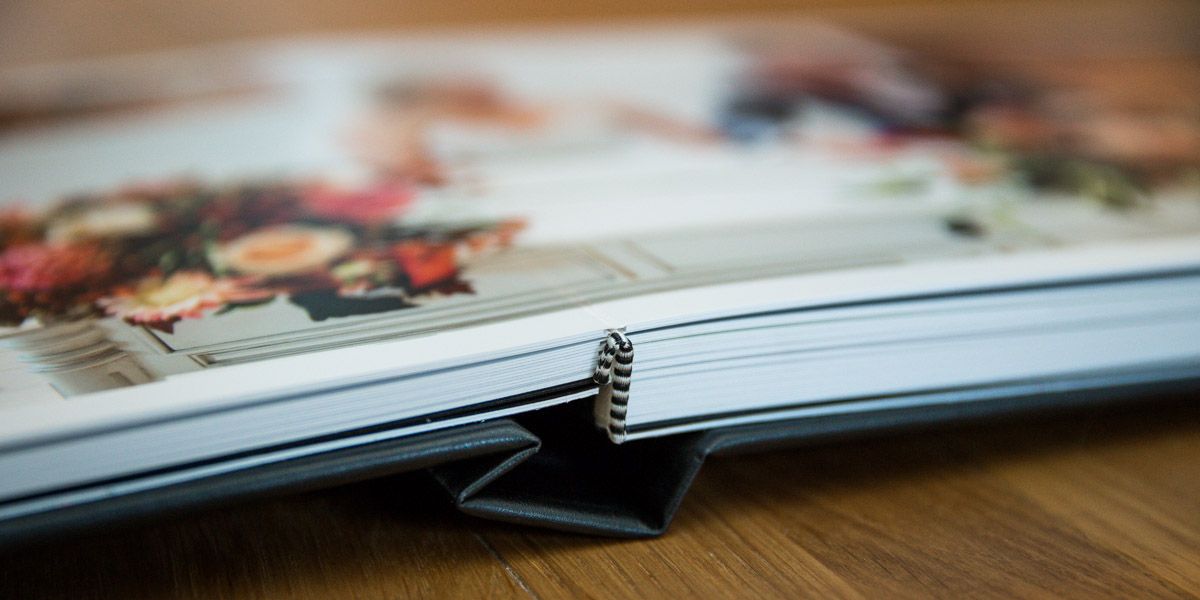 Close-up view of a spiral-bound notebook or planner showing pages with text and printed material.