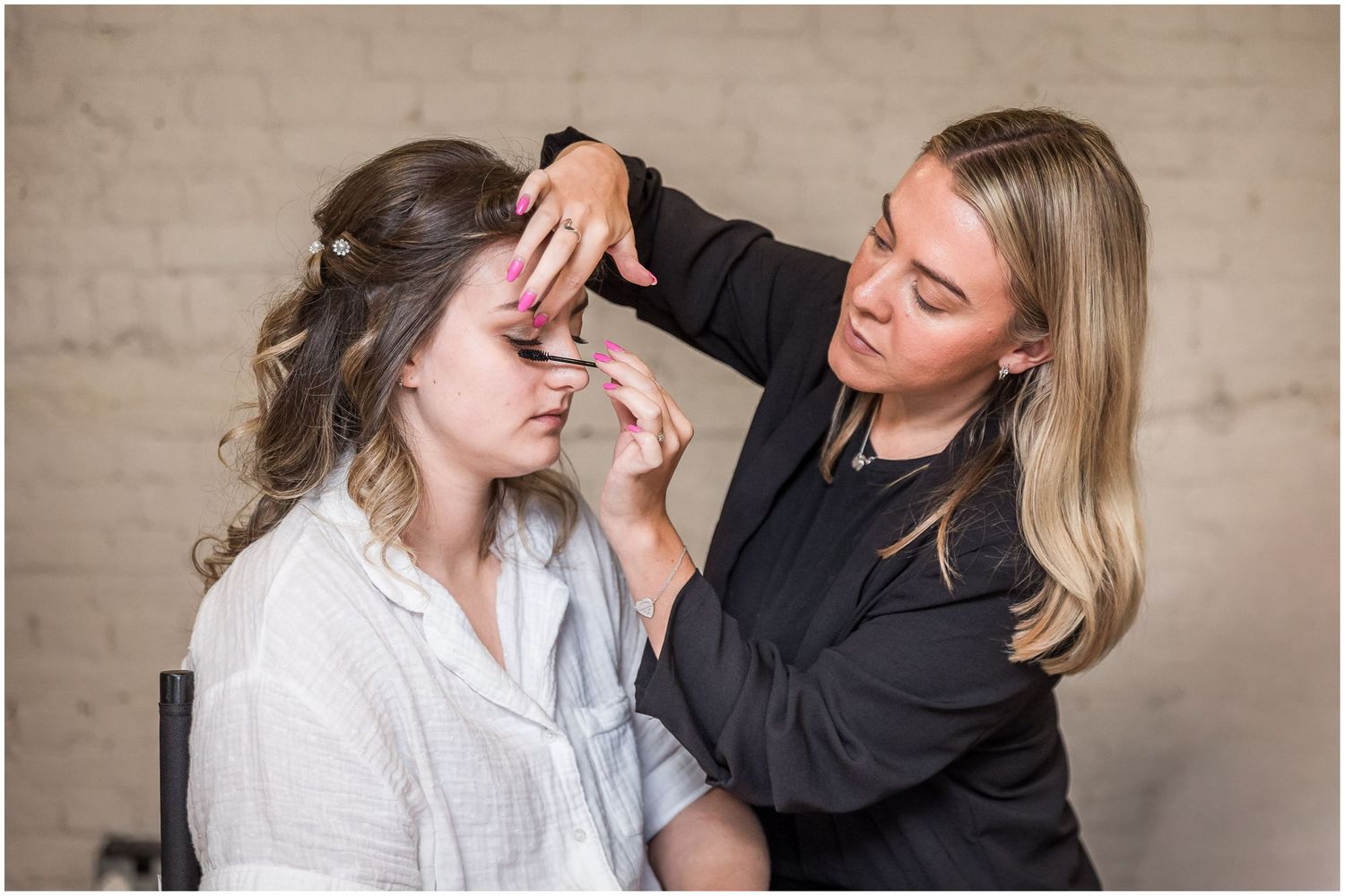 Bridal preparation photography in the dressing room at Clock Barn, Hampshire wedding venue near Whitchurch