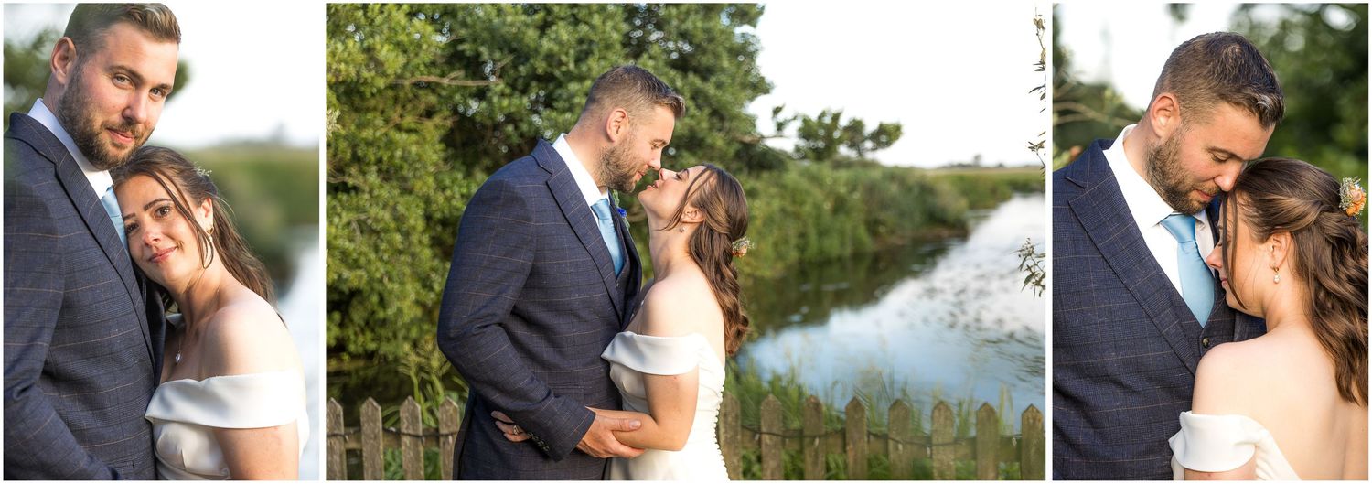 Bride and groom share a romantic moment outdoors by the river Avon, surrounded by lush greenery on their wedding day.