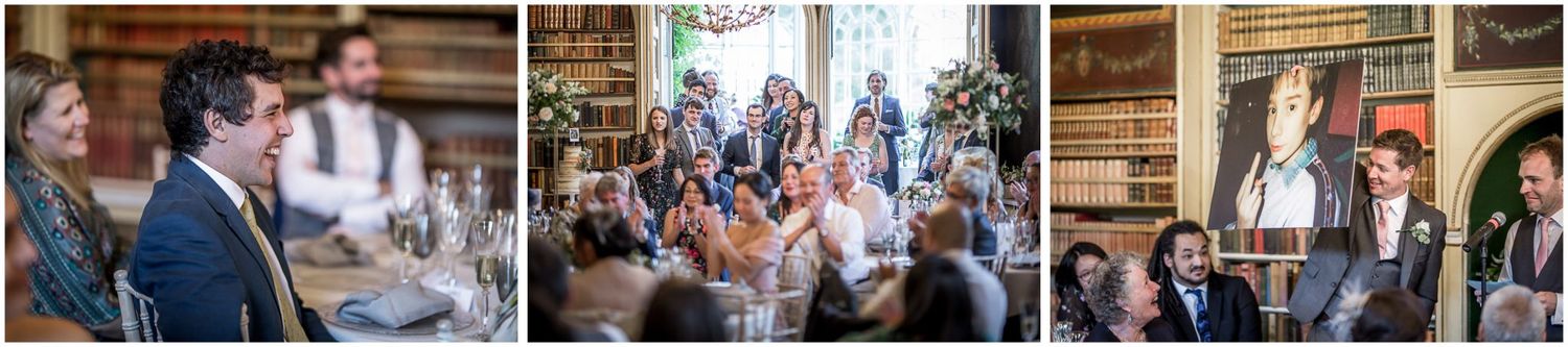 Wedding guests celebrating in a historic library venue with wooden bookshelves and classic decor.