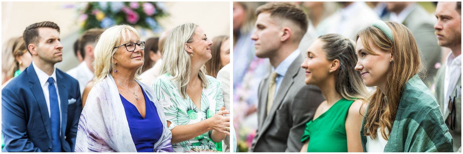 Wedding guests smiling and watching the marriage service
