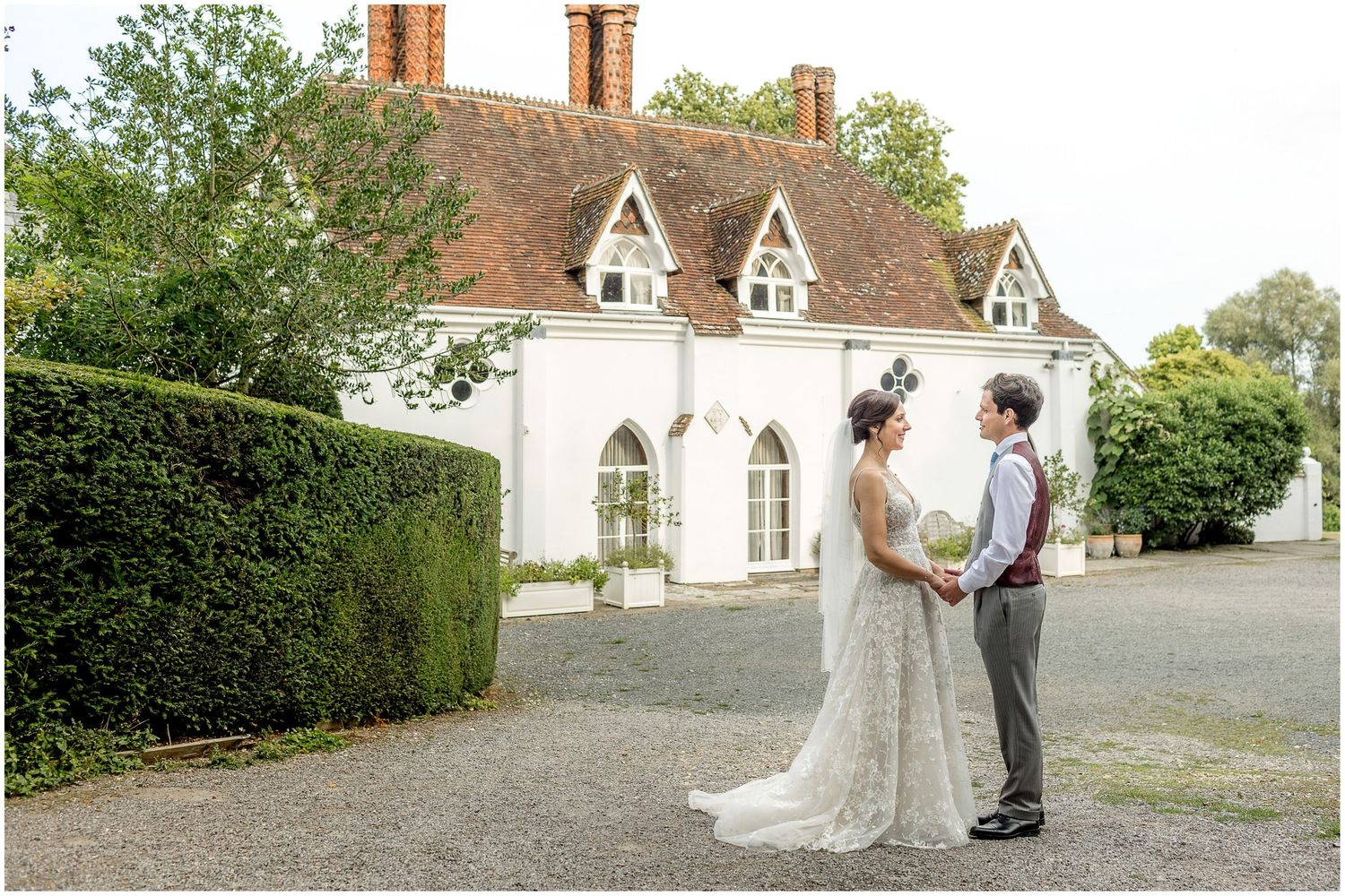 Elegant wedding photographs taken against a classic white church backdrop.