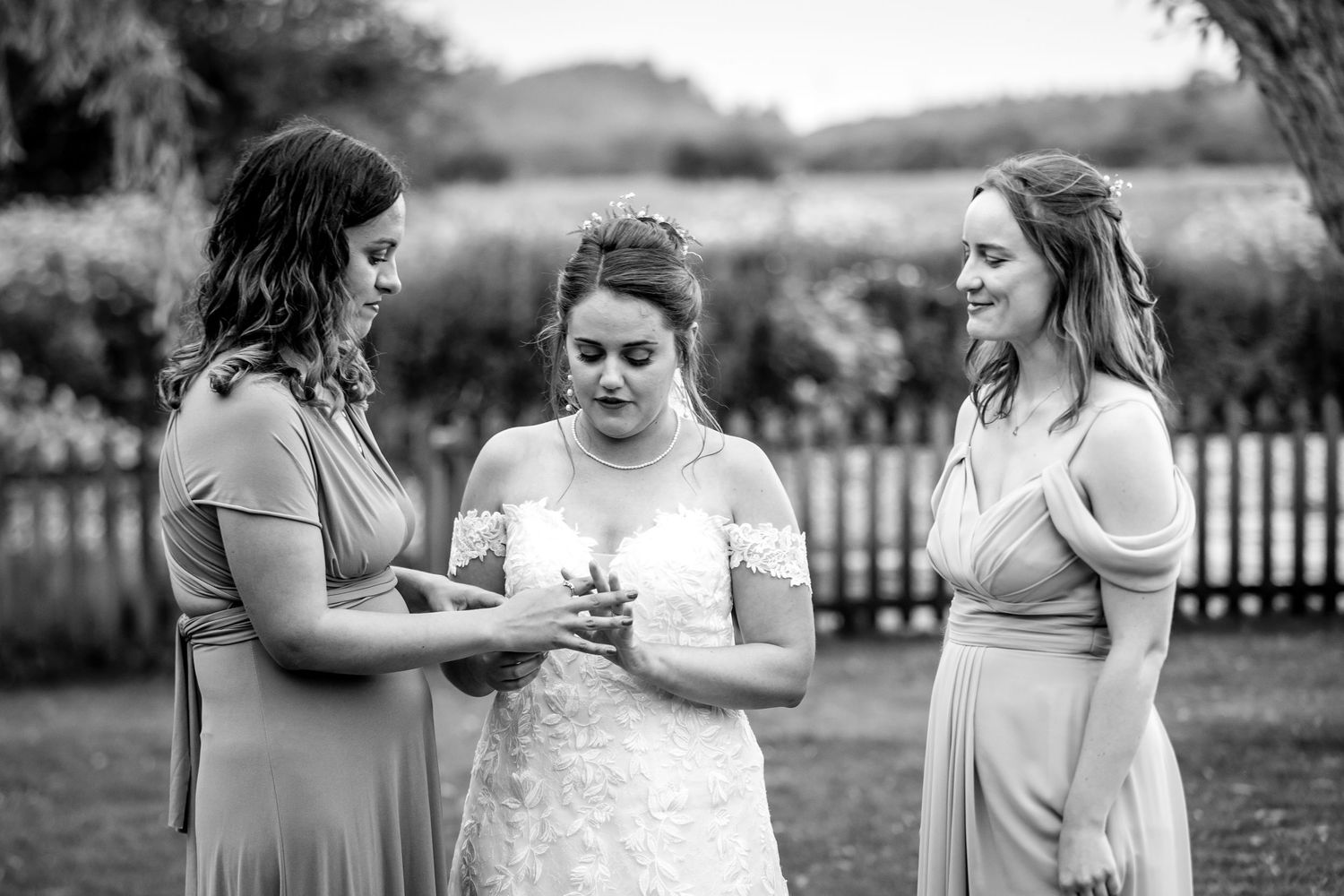 Candid black and white photos of wedding party members sharing joyful moments.