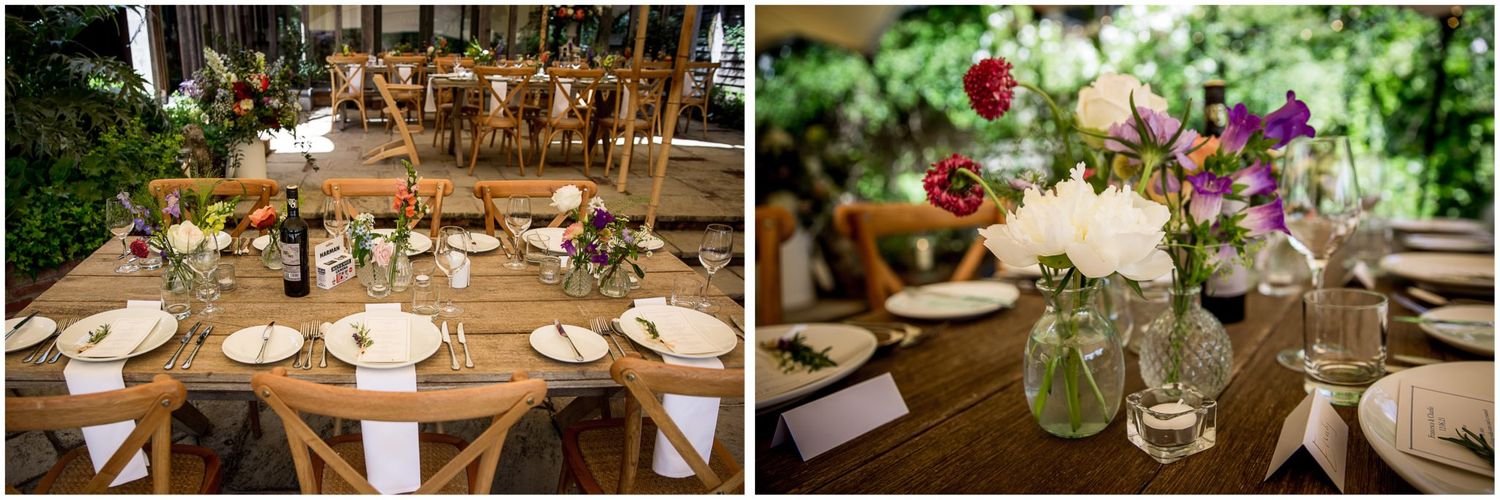 Elegant table settings at wedding reception with floral centerpieces and crystal glassware.