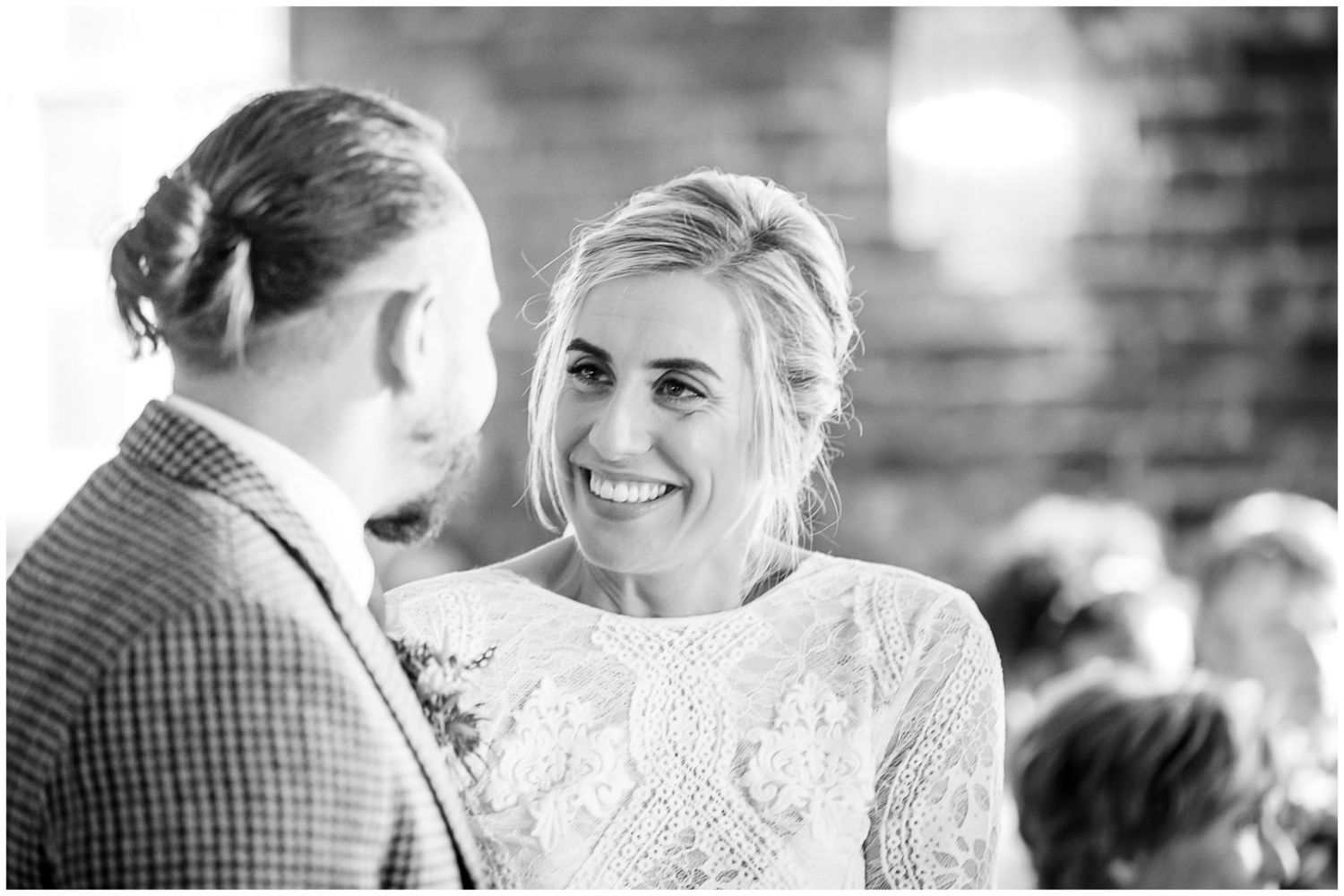 Black and white wedding ceremony photos showing intimate moments.