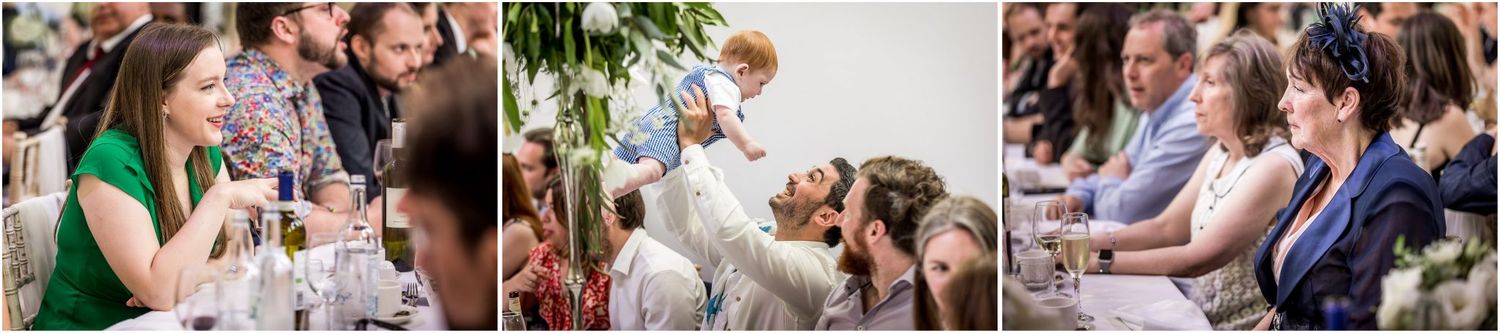 Wedding party enjoying festivities at an elegant venue with floral decorations.