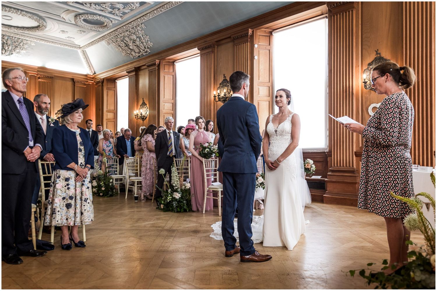 The bride and groom stand together at the start of the wedding ceremony