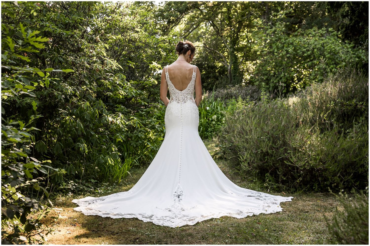 Bridal portrait showing the back of the wedding dress