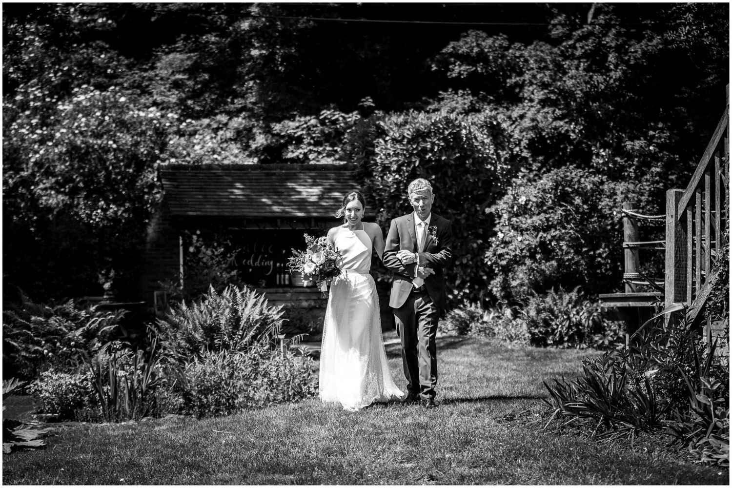 Black and white panoramic shots capturing moments from an intimate outdoor wedding ceremony.