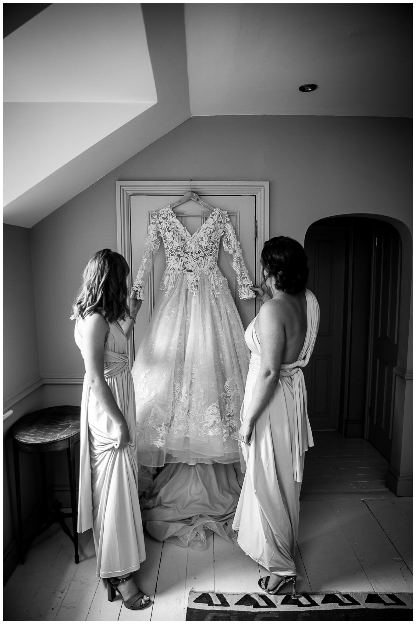 A sequence of black and white photos showing a wedding dress being prepared and admired from different angles.