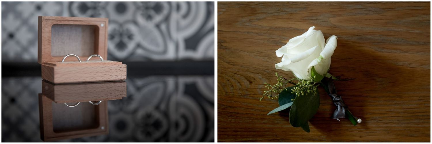 Close-up details of wedding decor including white roses on dark wooden surfaces.