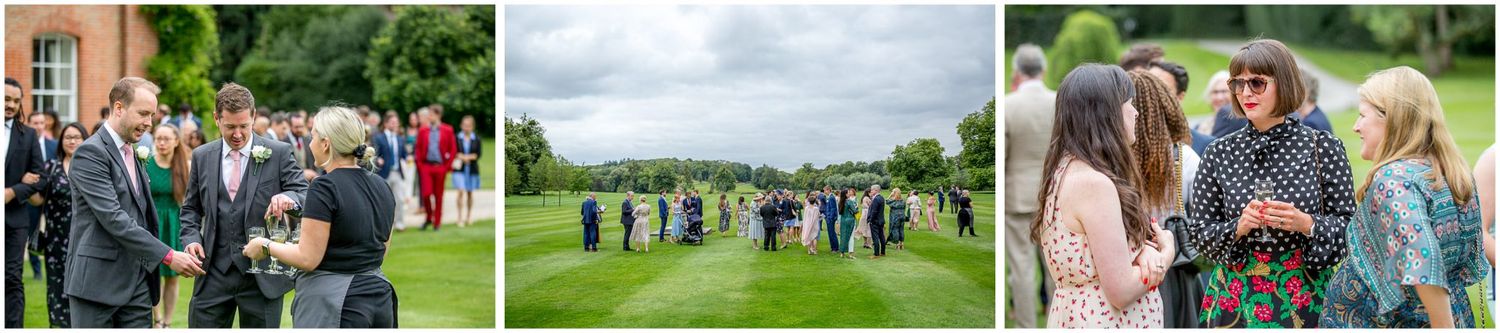 Wedding guests mingling on manicured lawn during outdoor reception.