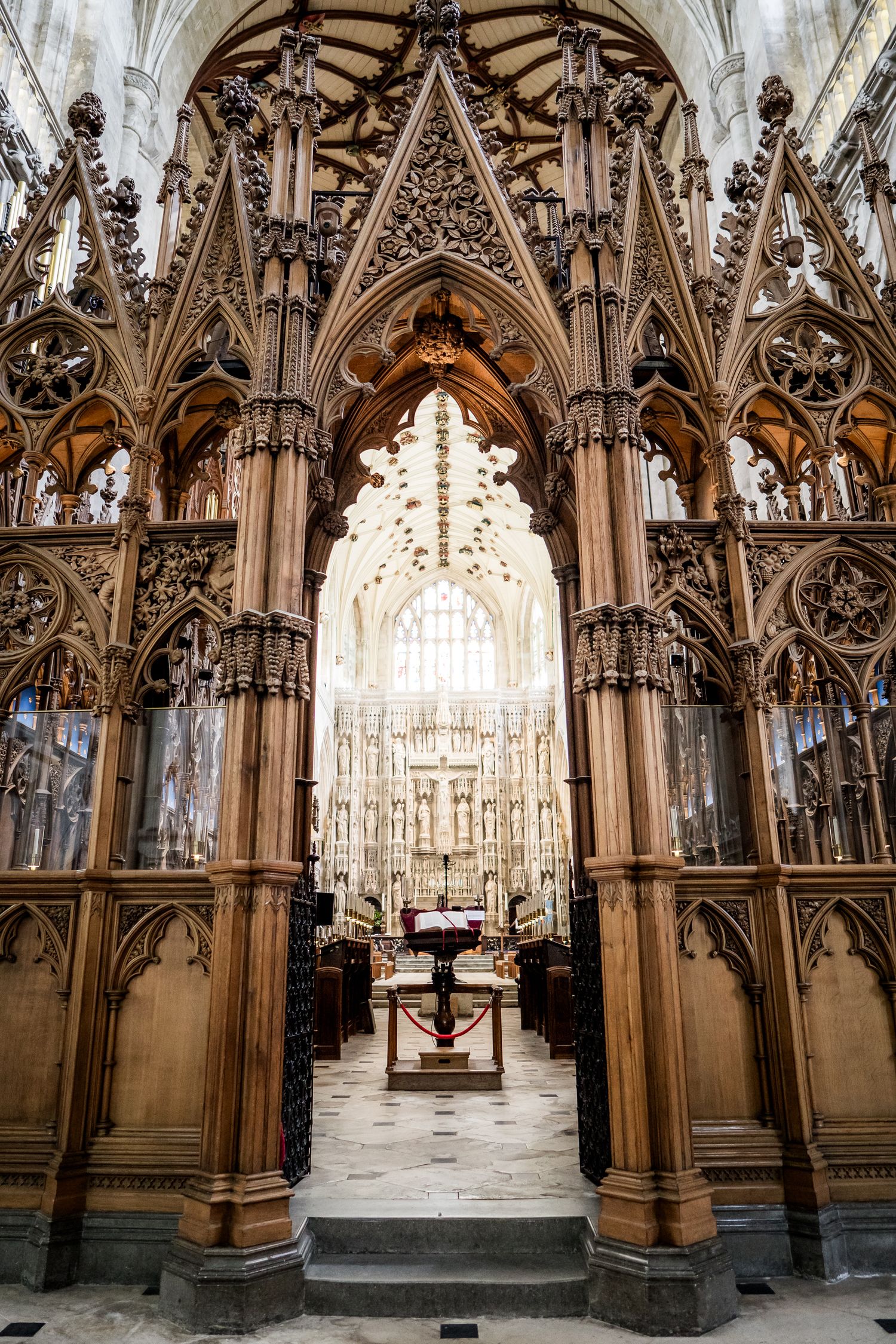 Intricate Gothic woodwork and architectural details in cathedral choir stalls.