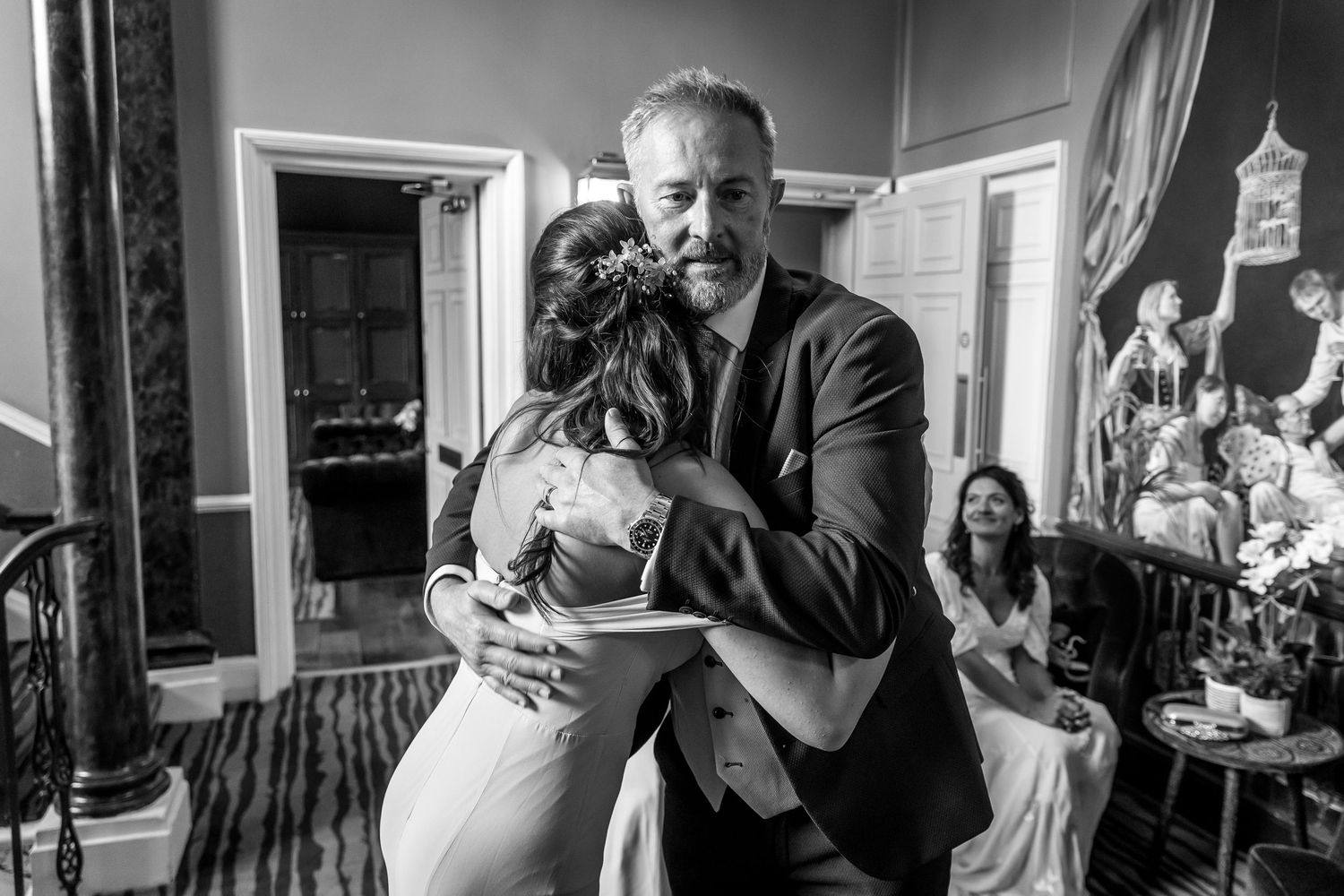 Wedding reception candid moments captured in black and white photography.