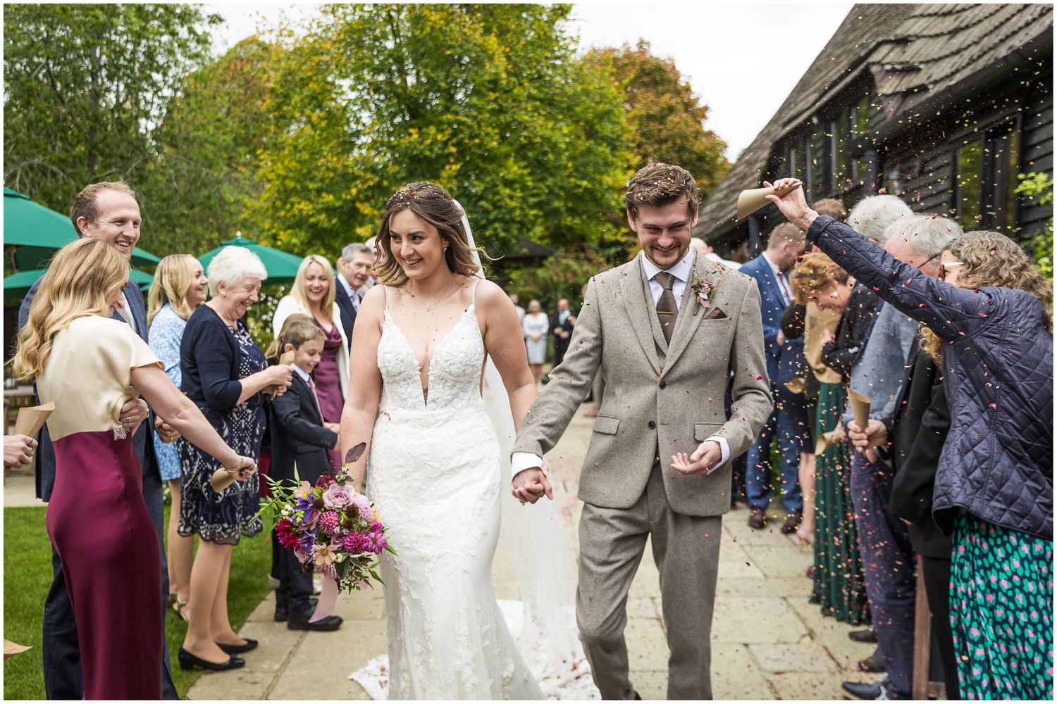 Confetti for the married couple at Clock Barn in Hampshire