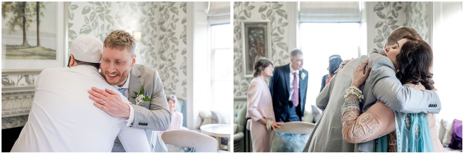 Emotional wedding day moments captured in a light-filled room with patterned wallpaper.
