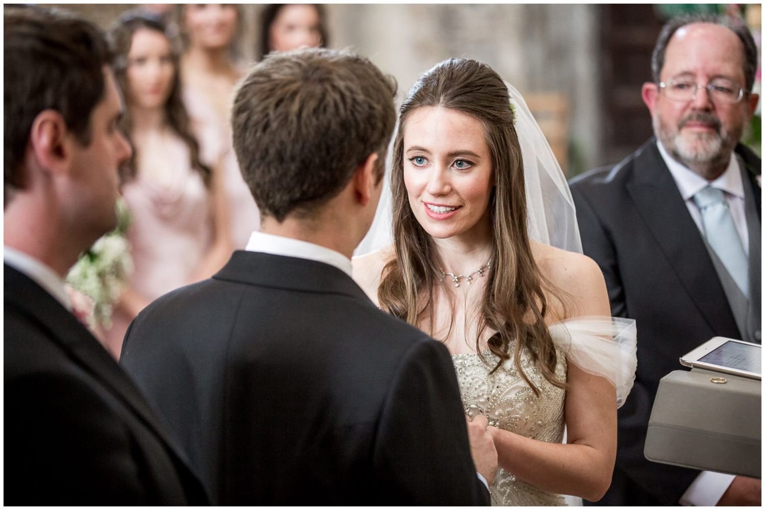 Intimate wedding ceremony moments with guests gathered in an indoor setting.