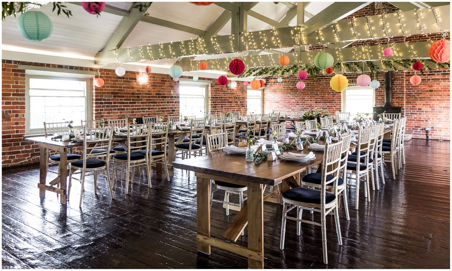 The Riverview Room at Sopley Mill set up for a wedding breakfast in a banqueting style