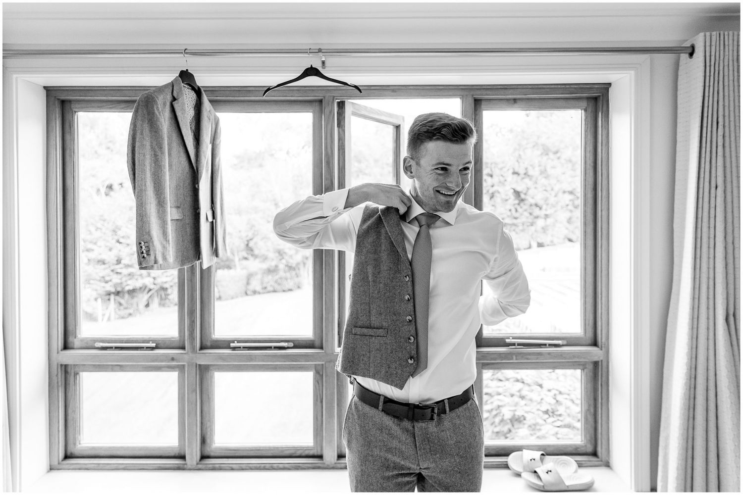 Black and white interior shots through multiple windows with natural lighting.