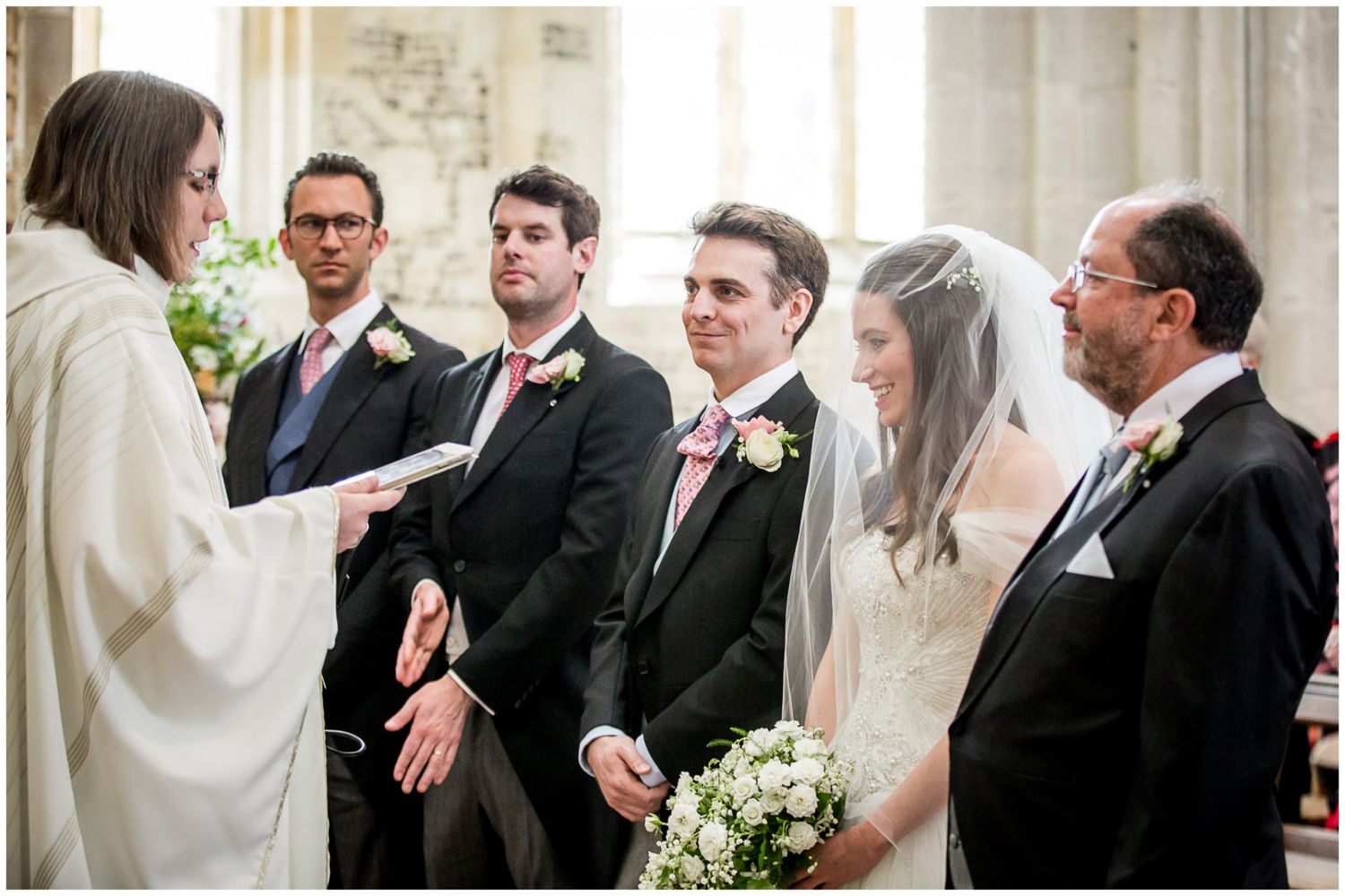 Wedding guests share joyful moments and conversations during an elegant indoor reception celebration.