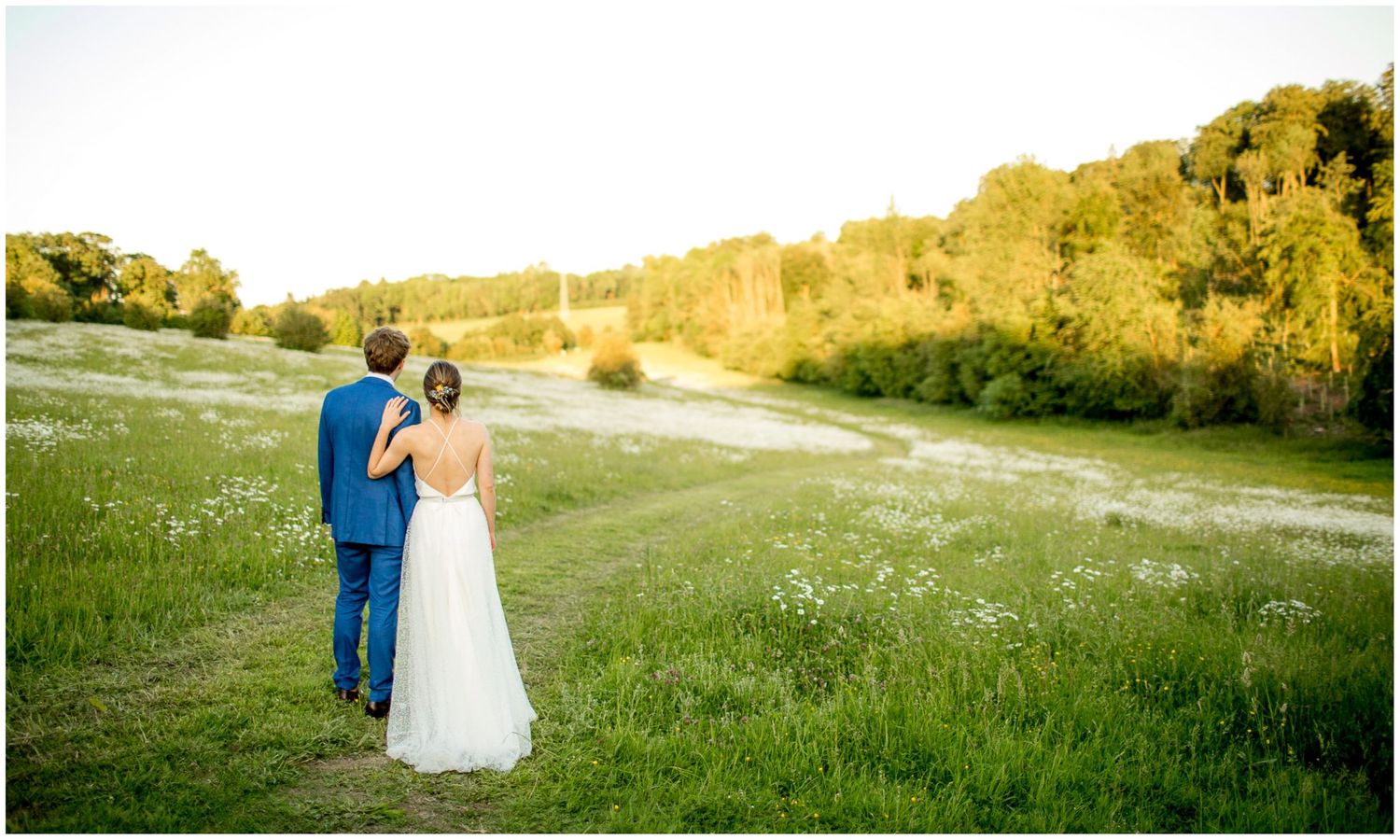Golden hour wedding photos in a scenic countryside setting.