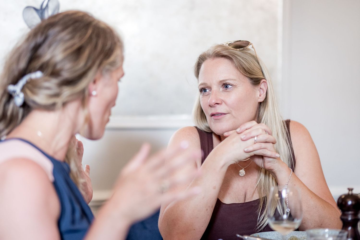 Candid moments captured during an elegant indoor social gathering.