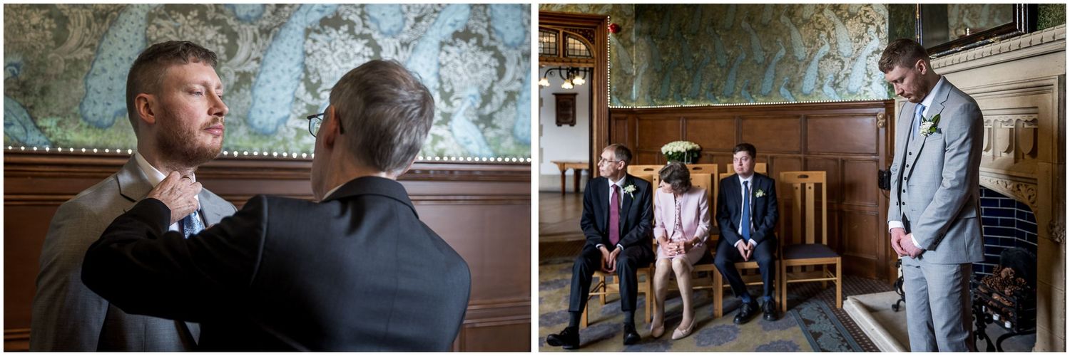 Wedding ceremony taking place in an elegant room with decorative wallpaper and wooden details.