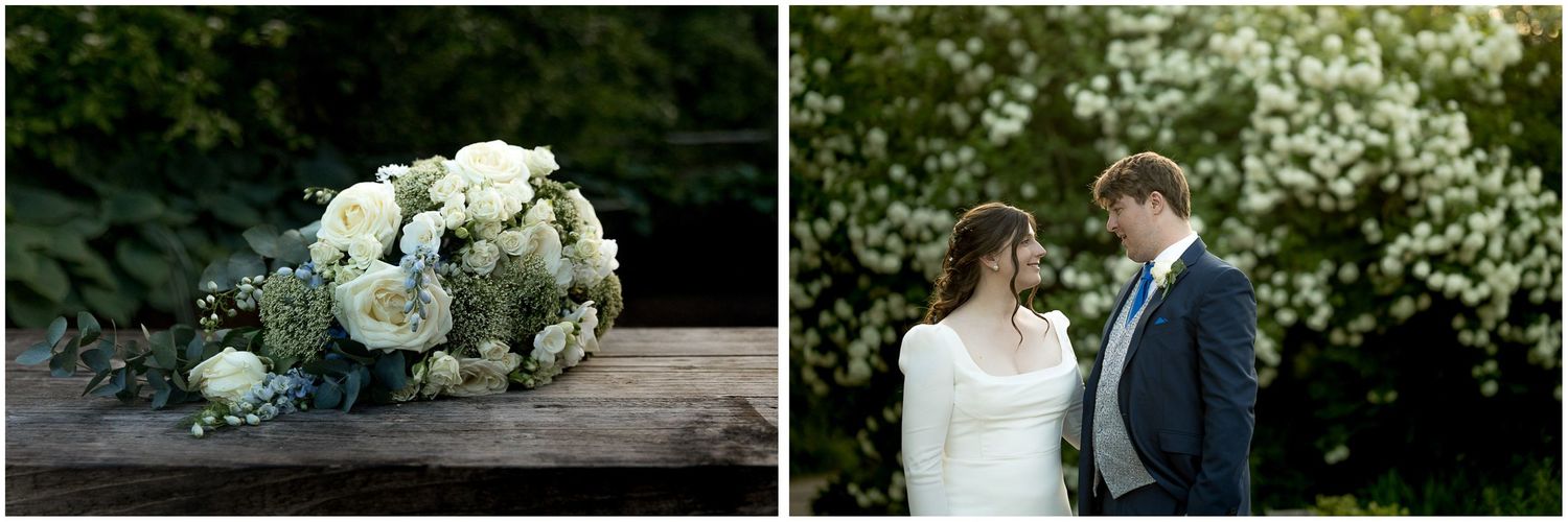 White floral arrangements and greenery decorate an outdoor wedding venue.