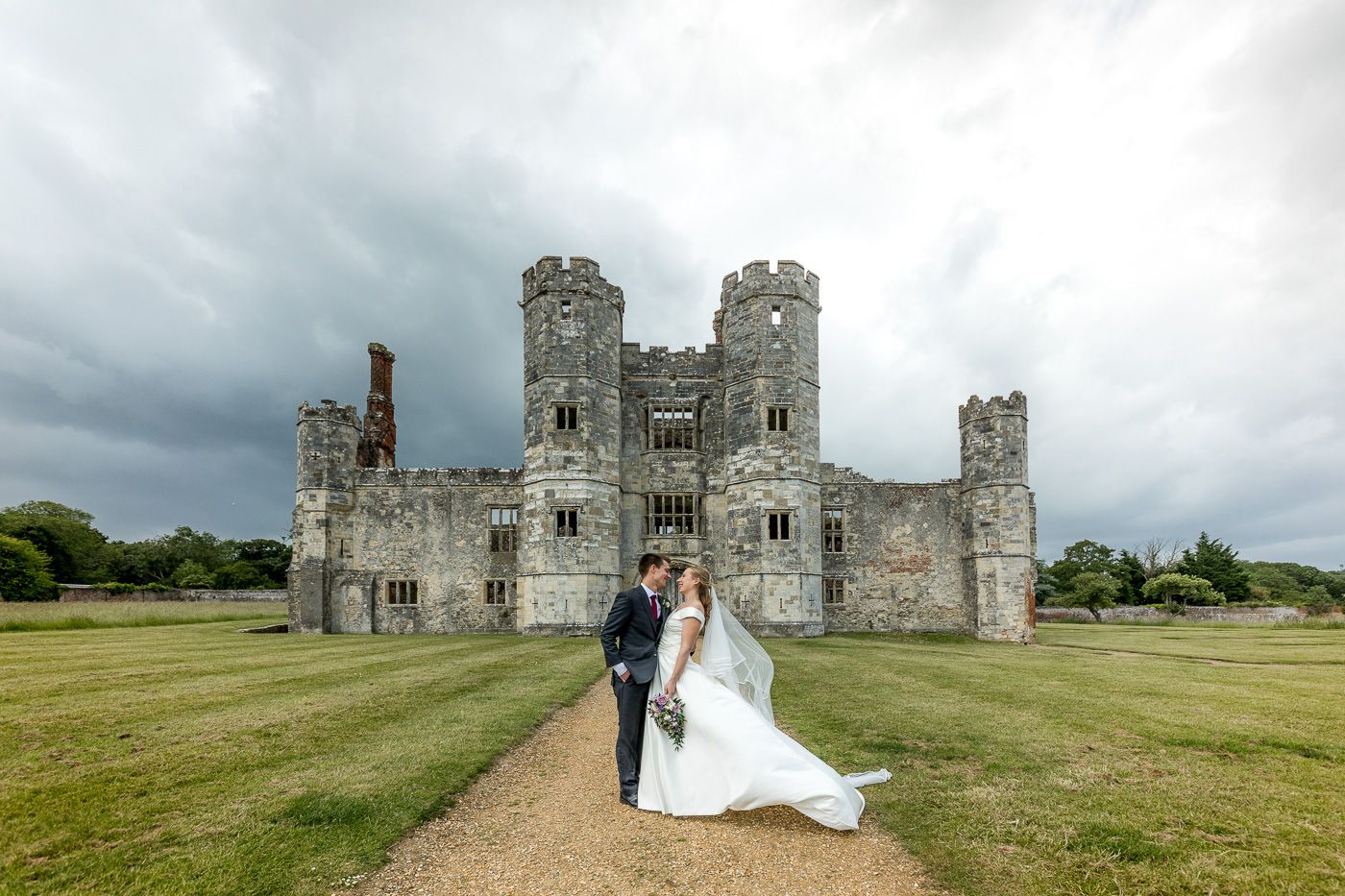 Historic stone castle wedding venue photographed from multiple angles under cloudy skies.