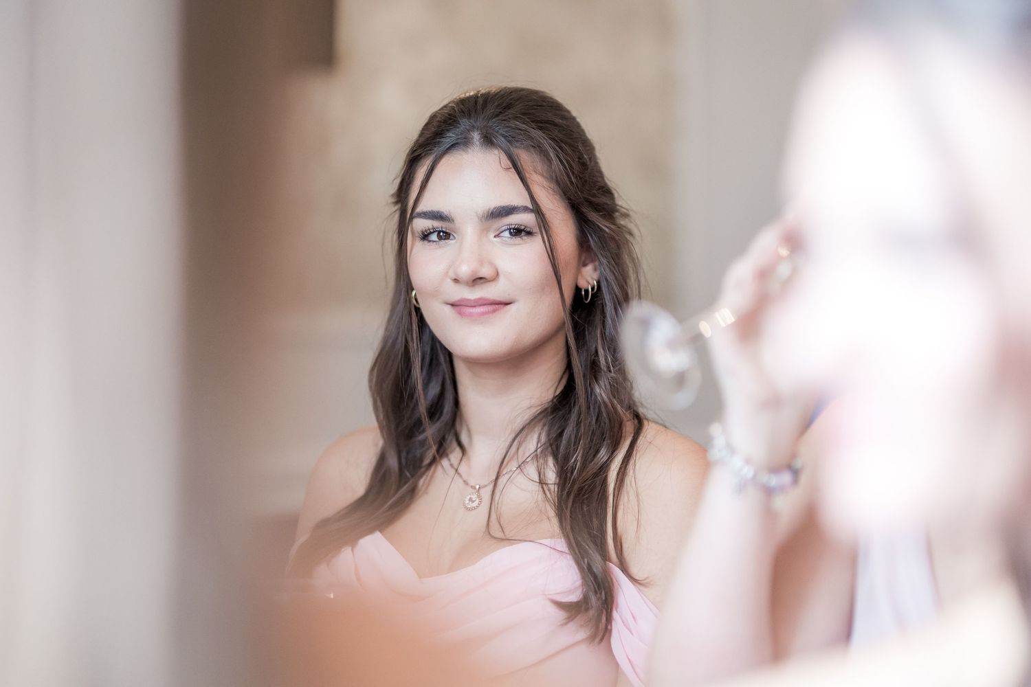 Candid moments captured during wedding reception speeches in an elegant dining room.