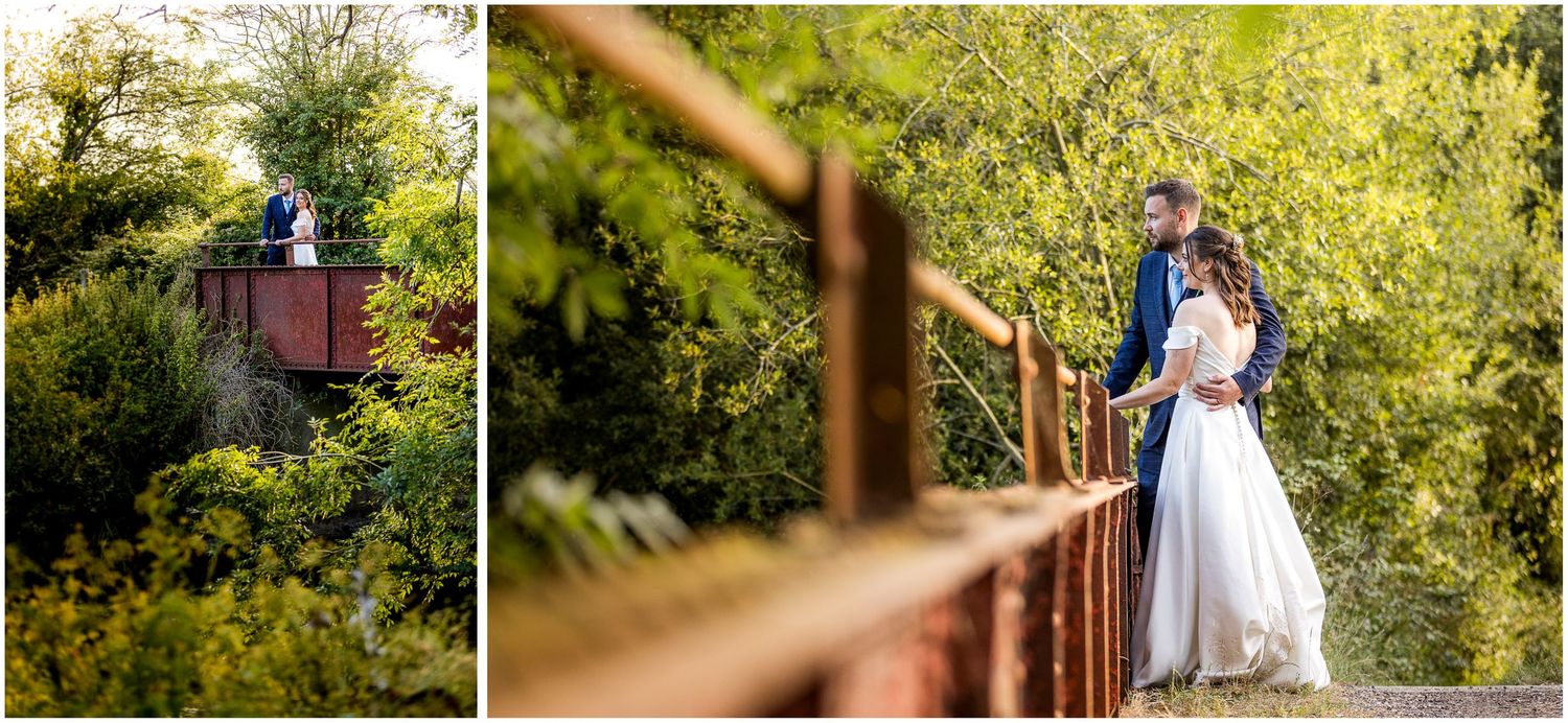 Bride and groom portrait on the old iron bridge behind Sopley Mill