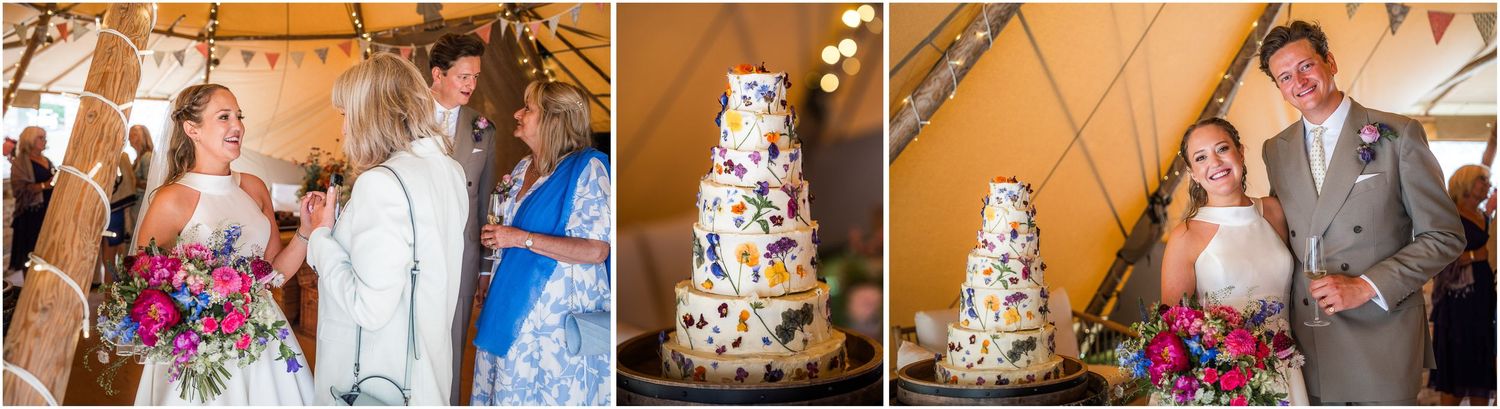 The bride and groom with their wedding cake in the stretch tent at the Holywell Estate