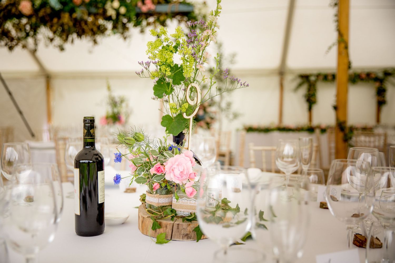 Wedding breakfast table set up in the marquee at Houghton Lodge in Hampshire