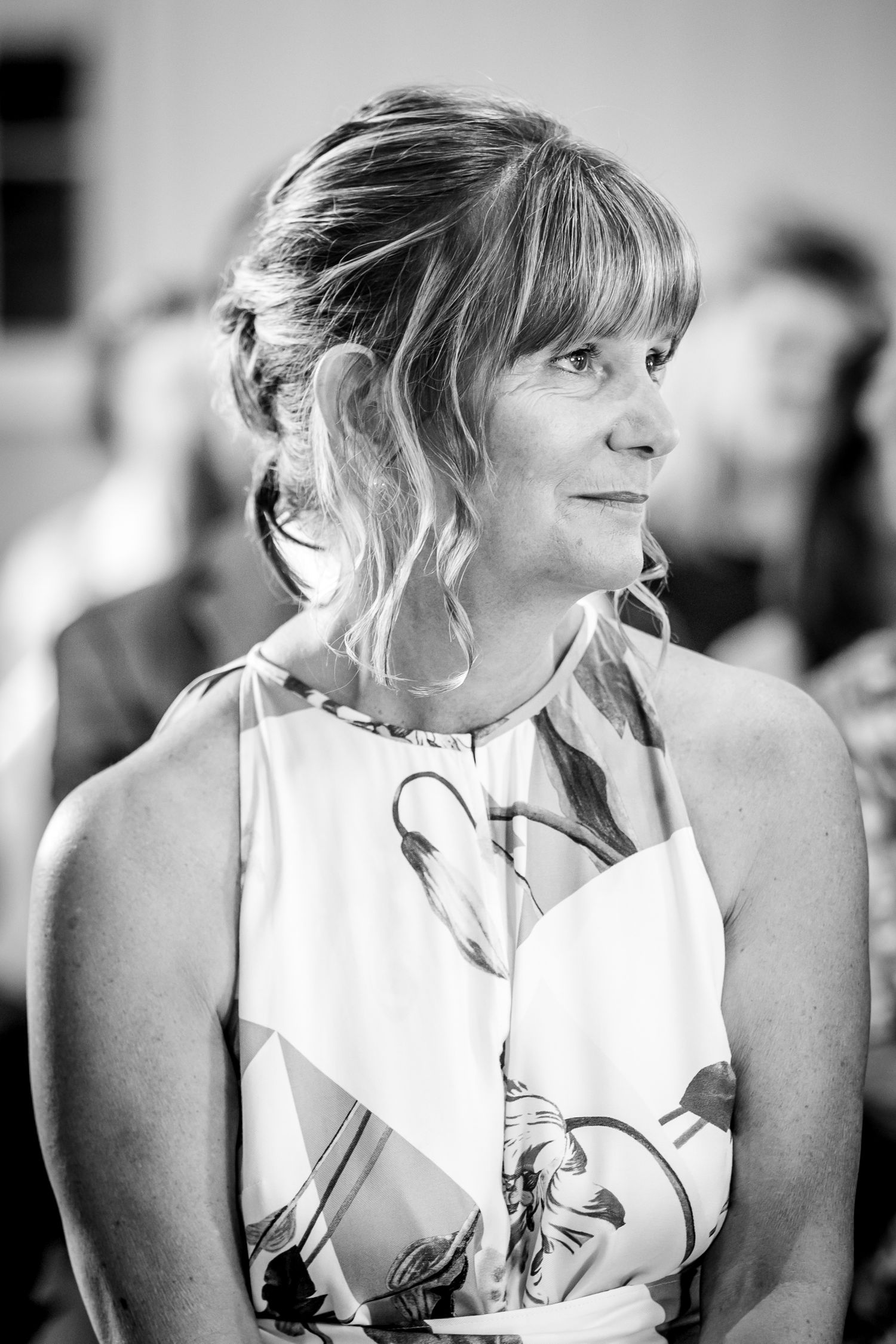 Black and white portrait sequence showing candid moments during a wedding celebration.