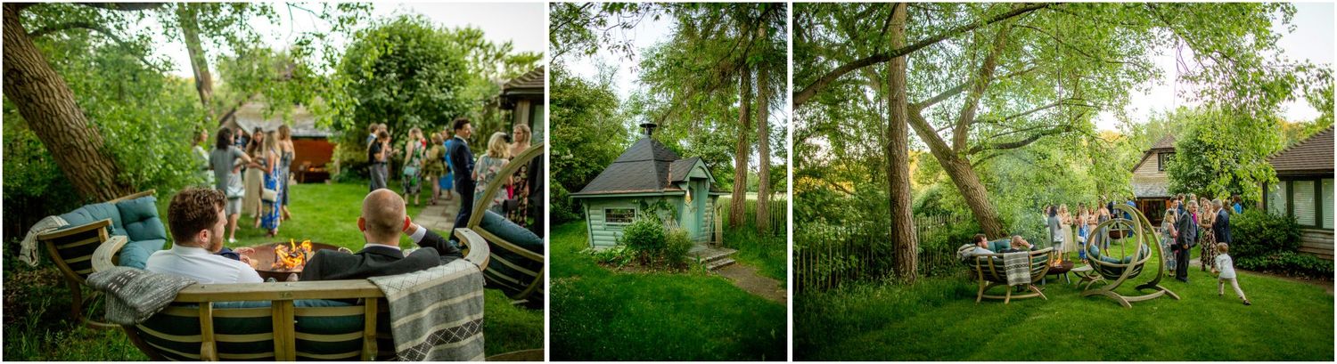 Elegant outdoor wedding reception with guests mingling in lush garden setting.