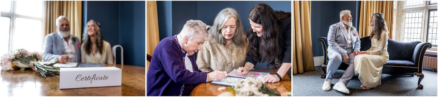 Three people reviewing documents and working together at a desk in Winchester registry office.