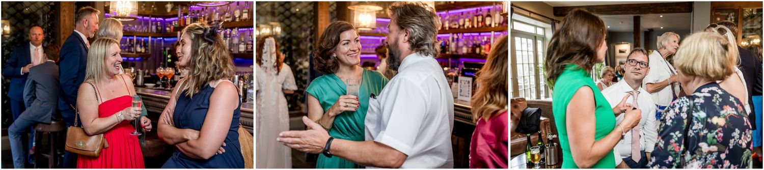 Wedding reception guests dancing and celebrating on a lively dance floor with colorful lighting.