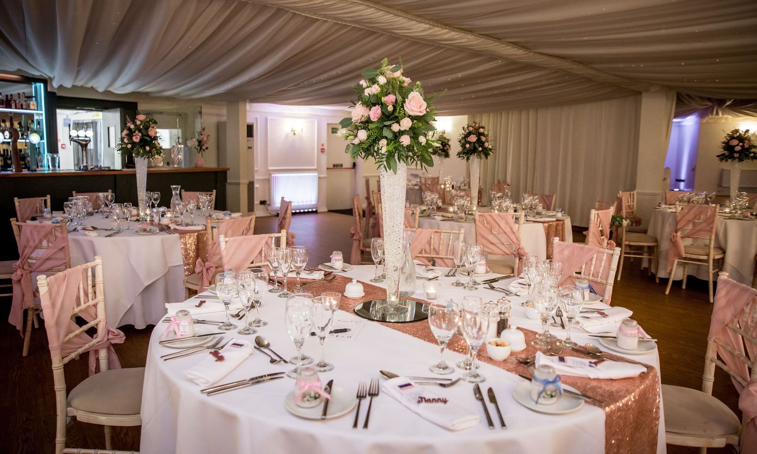Photograph of a dining table set up at Southdowns Manor ready for the wedding reception
