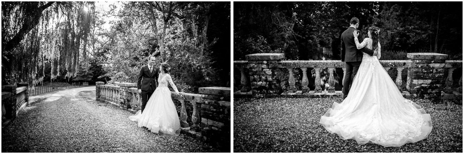 A romantic wedding photoshoot featuring a couple walking through a lush garden setting in formal attire.