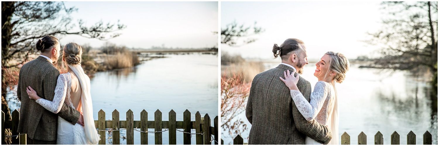 Scenic winter wedding photos with white picket fence and flooded landscape.