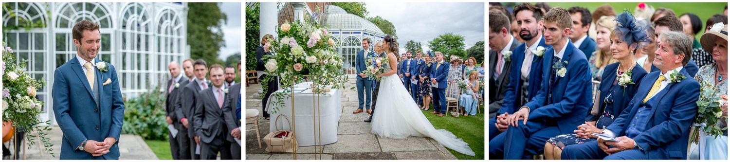 Outdoor wedding celebration with guests mingling on manicured grounds of a stately venue.