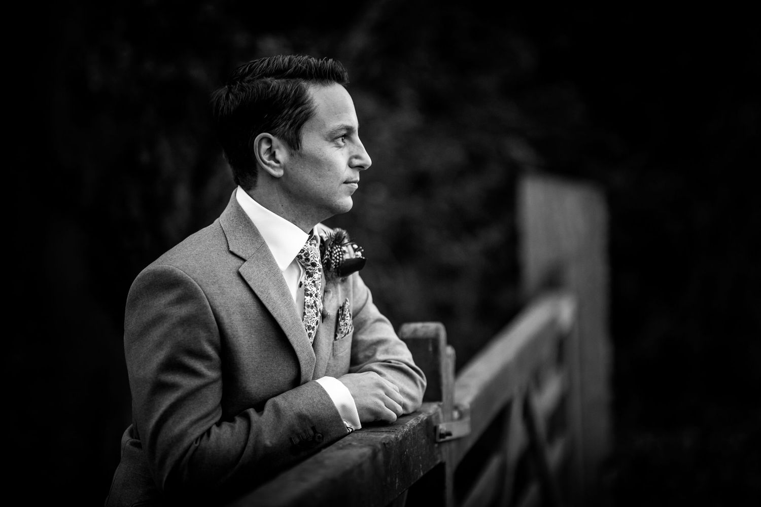 Black and white groom portrait at Clock Barn wedding venue