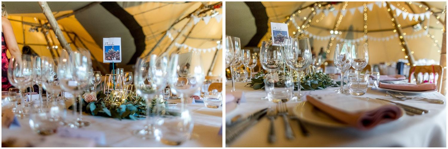 Table settings and decorations inside a tipi wedding venue with warm lighting.