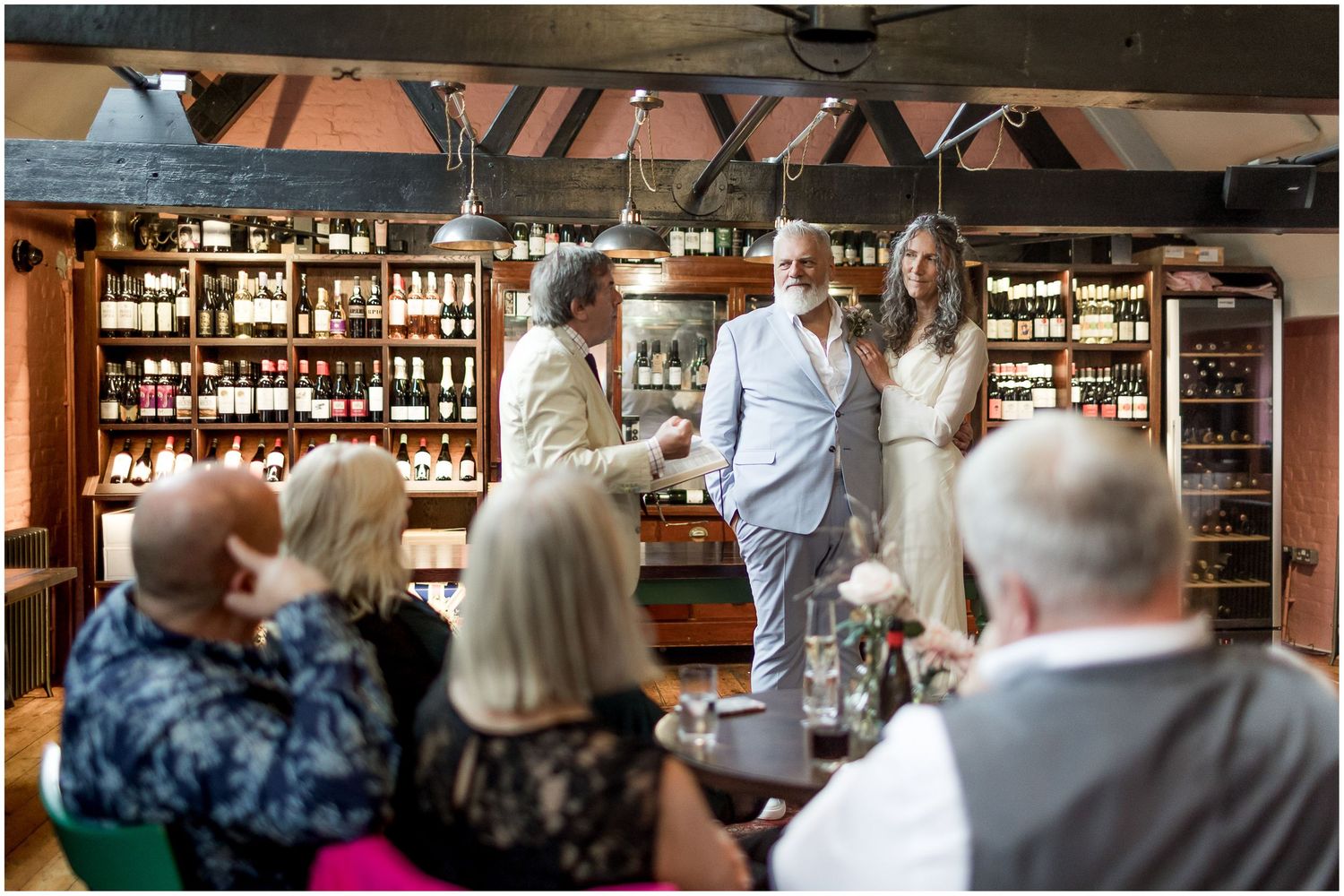 Wedding guests watch a marriage ceremony at Winchester's Abbey Mill.