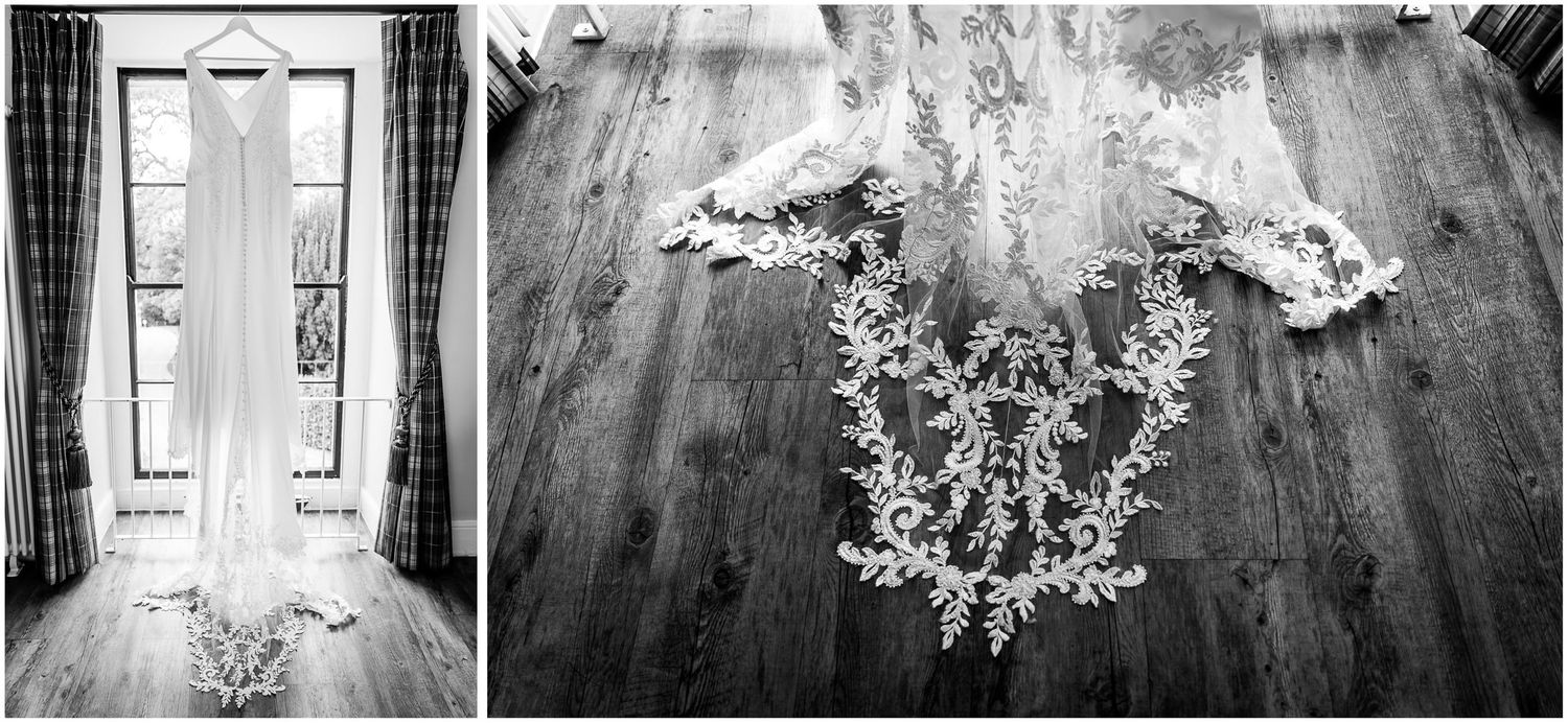 Black and white image of wedding dress and floral details on rustic wooden floor.
